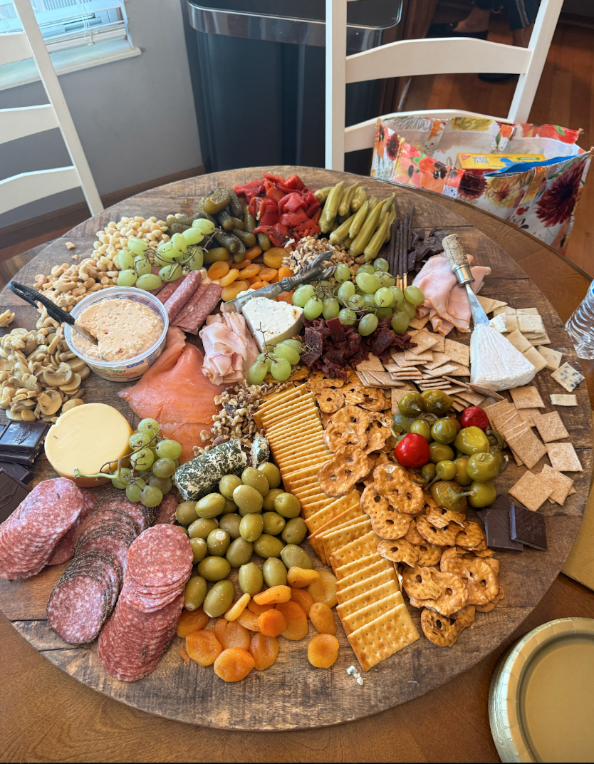 Charcuterie boards are great additions to a picnic, as they include many types of foods.